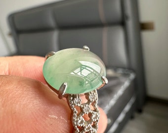 Ice emerald. Cabochon jadeite inlaid ring. adjustable size. Ring setting is 925 silver