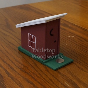 Exploding Outhouse Piggy Bank