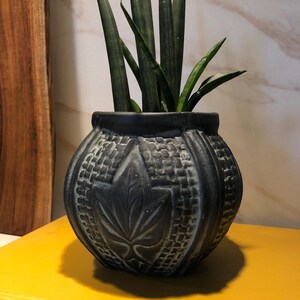 Tribal, naive terracotta plant pot holder.