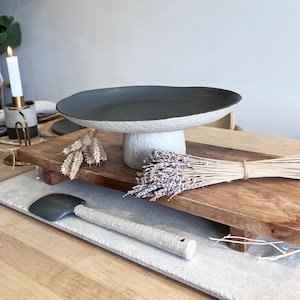 beige and charcoal ceramic centerpiece