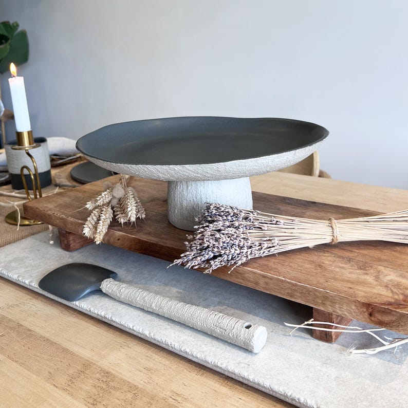 beige and charcoal ceramic centerpiece