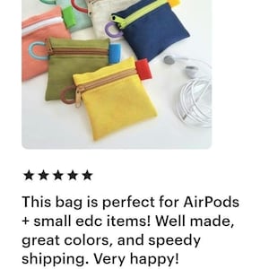 May include: A collection of small, square fabric pouches in various colours including yellow, olive green, navy blue, beige, and coral. Each pouch features a contrasting zipper closure, a matching side tab, and a circular pull ring on the zipper.