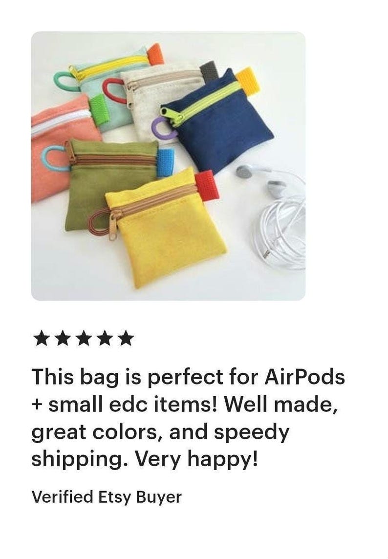 May include: A collection of small, square fabric pouches in various colours including yellow, olive green, navy blue, beige, and coral. Each pouch features a contrasting zipper closure, a matching side tab, and a circular pull ring on the zipper.