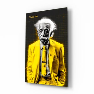 May include: A framed art print featuring a stylized portrait of Albert Einstein in a yellow suit and tie. The background is black with a grid pattern and the text "I Told You". The image is a striking blend of black, white, and yellow.