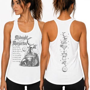 May include: A white racerback tank top featuring black ink-style illustrations. The front displays the text Midnight Margaritas with a crescent moon, a frog, a moka pot, and a margarita glass. The back features a vertical column of icons.