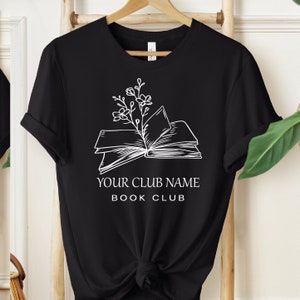 a t - shirt with a book and a plant on it
