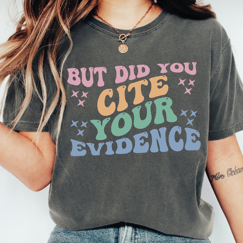 a woman wearing a t - shirt that says but did you cite your evidence?