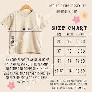 May include: A beige toddler fine jersey tee by Rabbit Skins 3321 displayed with a size chart. The chart lists sizes 2T through 5T-6T with corresponding width and length measurements in inches. Instructions for measuring a shirt are included.