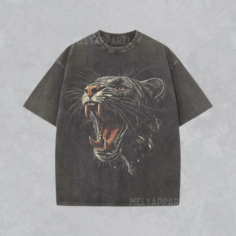 May include: Black t-shirt with a vintage-style graphic of a roaring panther on the front.