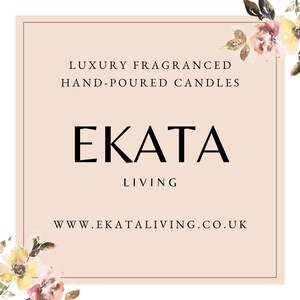 May include: A square, light pink graphic with the text "LUXURY FRAGRANCED HAND-POURED CANDLES" above the word "EKATA" in a bold, black font. Below is the word "LIVING" and the website address. Floral accents are in the corners.