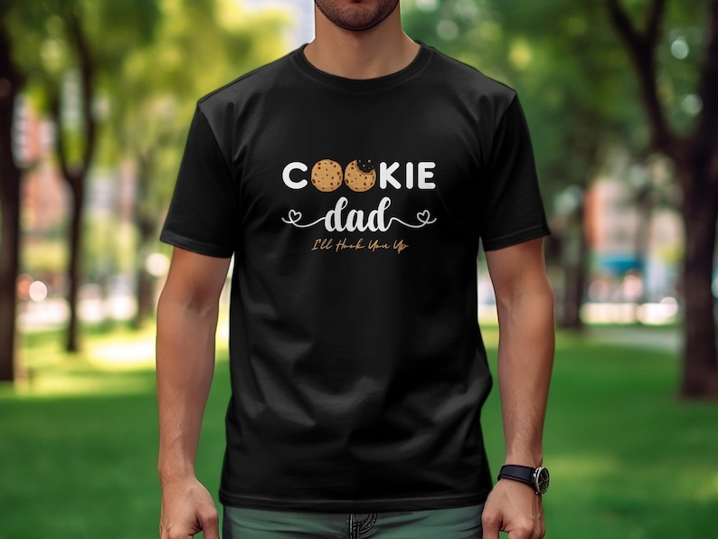 May include: Black t-shirt with a white graphic that says "Cookie Dad" with two cookie images and the text "I'll think you up".