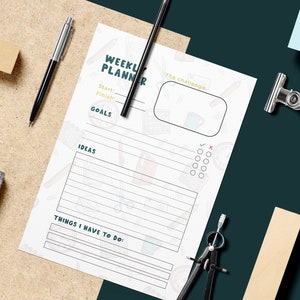 May include: A white weekly planner with a green title "Weekly Planner" and a section for goals, ideas, and things to do. The planner is decorated with a doodle pattern of office supplies.