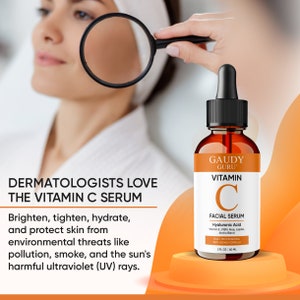 May include: A brown glass bottle of Gaudy Guru Vitamin C Facial Serum with a dropper. The label includes the words "Vitamin C Facial Serum" and "Hyaluronic Acid". The image also includes the text "Dermatologists Love The Vitamin C Serum".