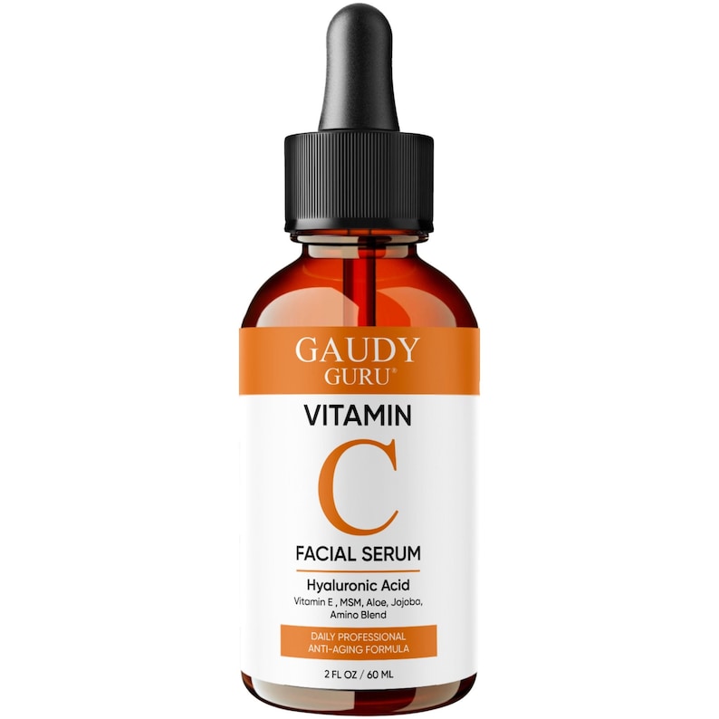May include: A brown glass bottle of Gaudy Guru Vitamin C Facial Serum with a black dropper. The label features the brand name, product name, and ingredients. The bottle contains 2 fl oz / 60 ml of serum.