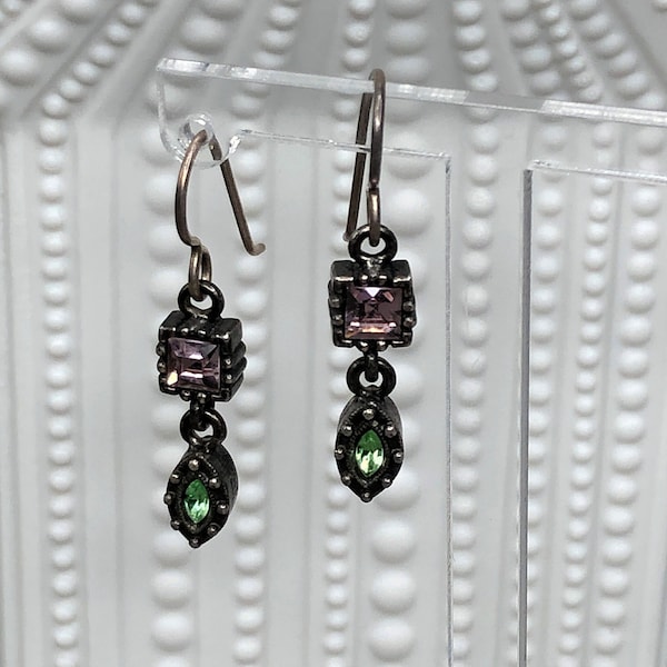 PATRICIA LOCKE miniature earrings with two faceted purple and green crystals.