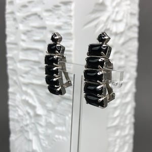 Vintage WHITE ear clips with black crystals.