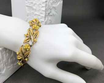 Vintage CORO signed gold tone bracelet with yellow enamel leaves and bakelite beads