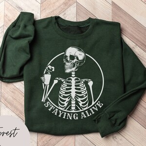 Staying Alive Skeleton Halloween Sweatshirt, Funny Skeleton Sweater, Skeleton Drinking Coffee, Trendy Coffee Shirt, Coffee Lovers Skull Gift