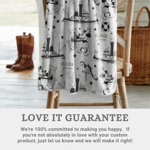 May include: A white blanket featuring a black and white repeating pattern of a cartoon mouse character, steamboat ships, ship wheels, life preservers, and stars. The text Oliver James is printed in a script font throughout the fabric design.