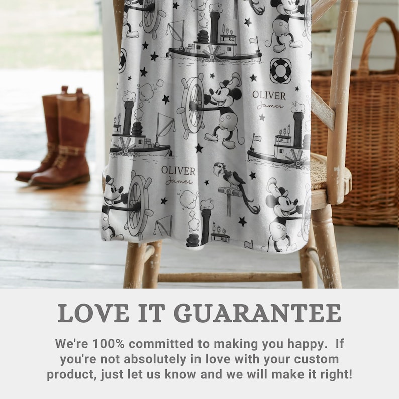 May include: A white blanket featuring a black and white repeating pattern of a cartoon mouse character, steamboat ships, ship wheels, life preservers, and stars. The text Oliver James is printed in a script font throughout the fabric design.