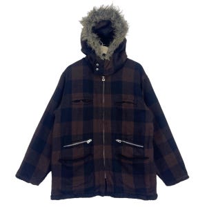 May include: A brown and black plaid jacket with a faux fur lined hood. The jacket has a zipper closure and multiple pockets.