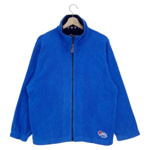 May include: A blue fleece zip-up jacket with a black zipper and a red, white, and blue logo that says "Ocean Pacific" on the lower right side.