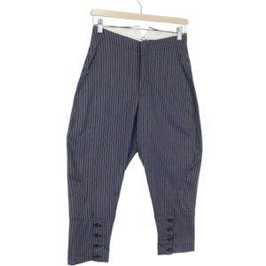 May include: Gray and white striped pants with a button fly and button details at the cuffs.