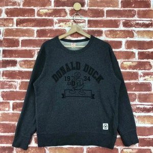 Vintage Donald Duck Sweatshirt Rundhalsausschnitt großes Logo Disney UT Collaboration Pullover Pullover Sweatshirt Größe Medium