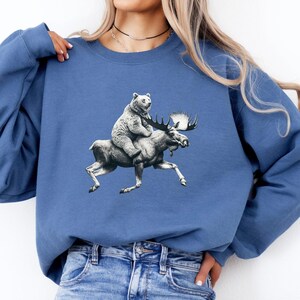Bear Riding Moose Sweatshirt, Funny Animal Sweatshirt, Unique Graphic Print, Cozy Gift for Animal Lovers, Trendy and Comfortable Sweater
