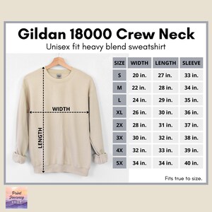 May include: A beige Gildan 18000 crew neck sweatshirt displayed on a hanger. The image includes a size chart with measurements in inches for width, length, and sleeve length, ranging from size small to 5X.