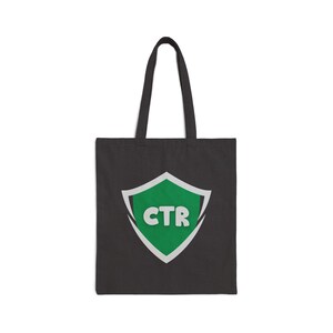 May include: A black tote bag with a green and white shield logo that says "CTR" on it.