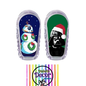 May include: Two Christmas themed medical device covers. One features a snowman with a wreath and the other features Darth Vader wearing a Santa hat. The covers are made by Diabetic Decor by Dominica.