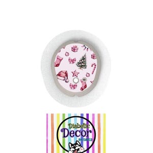 May include: A pink and white Christmas themed sticker for a diabetic pump or continuous glucose monitor. The sticker features a Christmas tree, presents, candy canes, and other festive decorations. The sticker is designed by Diabetic Decor by Dominica.