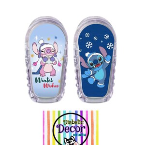 May include: Two blue and white insulin pump covers with a winter theme. One cover features Stitch wearing a pink hat and holding a mug. The other cover features Stitch wearing a blue hat and holding a snowflake. Both covers have the text "Winter Wishes".