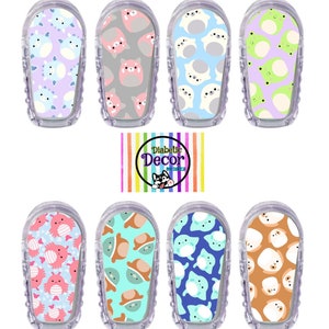May include: Eight different colorful and patterned stickers for a continuous glucose monitor (CGM). The stickers feature cute animal designs, including a cat, a dog, a frog, and a crab. The stickers are designed to cover the CGM device and add a personal touch.