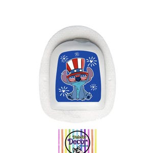 May include: A white medical device with a blue graphic of a cartoon character wearing an Uncle Sam hat and sunglasses. The graphic is on a blue background with white starbursts. The device has a white, fluffy border. The logo for Diabetic Decor is at the bottom.