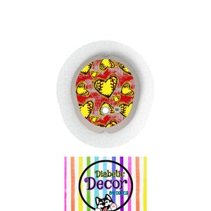 May include: A red and yellow patterned sticker with a softball design. The sticker is for a diabetic pump and has the text "Diabetic Decor by Danica" on it.