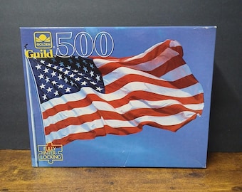 Rompecabezas vintage de 500 piezas con la bandera estadounidense de Golden Guild, sellado y patriótico.