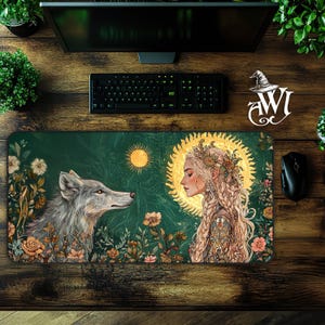 May include: A green and gold illustrated mousepad featuring a wolf and a woman with a flower crown. The woman is surrounded by a golden sun and the wolf is surrounded by flowers.