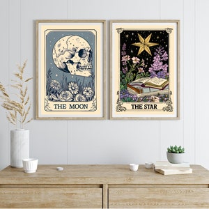 May include: Two framed tarot card prints, one with a skull and the text "THE MOON" and the other with a star and the text "THE STAR".