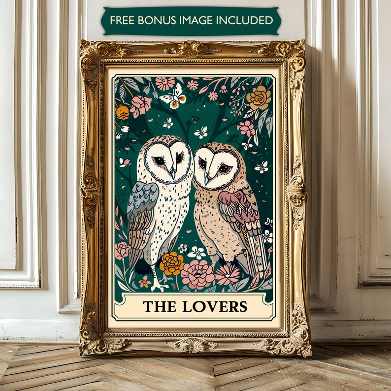 May include: A vintage-style tarot card illustration featuring two owls perched on a branch surrounded by flowers. The card is titled "The Lovers" in a gold frame.