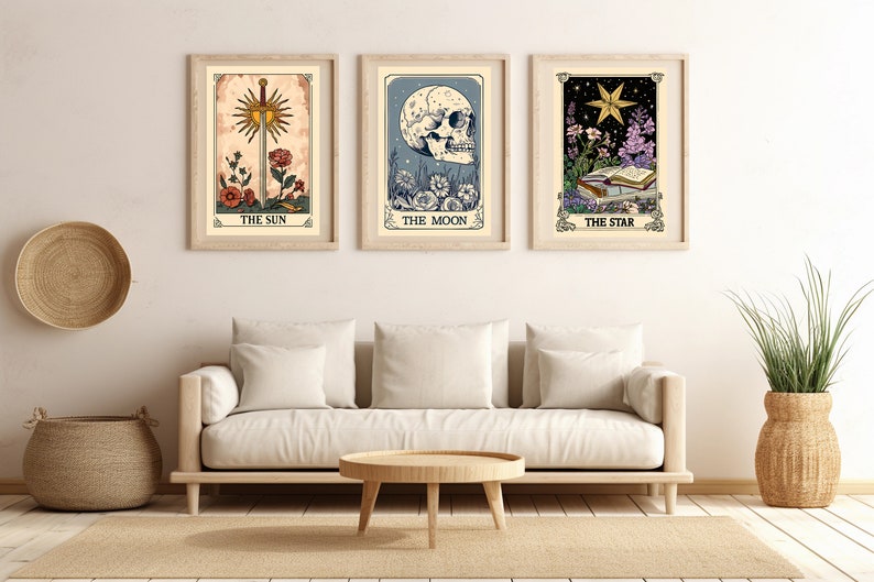 May include: Three tarot card prints with illustrations of The Sun, The Moon, and The Star. Each print has a white background with a gold frame and the name of the card printed below the image.