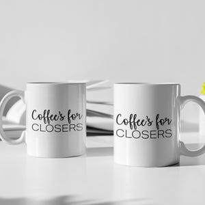May include: Two white ceramic mugs with black text that reads "Coffee's for closers".