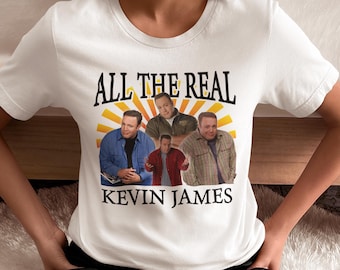 May include: White t-shirt featuring a graphic of four men and the text "All the Real Kevin James".