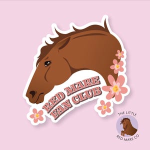 May include: A sticker featuring a brown horse head with pink flowers and the text "Red Mare Fan Club". The sticker is on a pink background. The bottom right corner of the image shows a smaller sticker with a brown horse head and the text "The Little Red Mare Co."