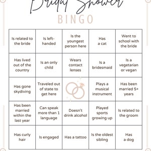 May include: A Bridal Shower Bingo game card with a white background and decorative border. The grid contains twenty-five squares with text prompts such as Is related to the bride, Has a cat, and Is engaged, featuring a central ring icon graphic.