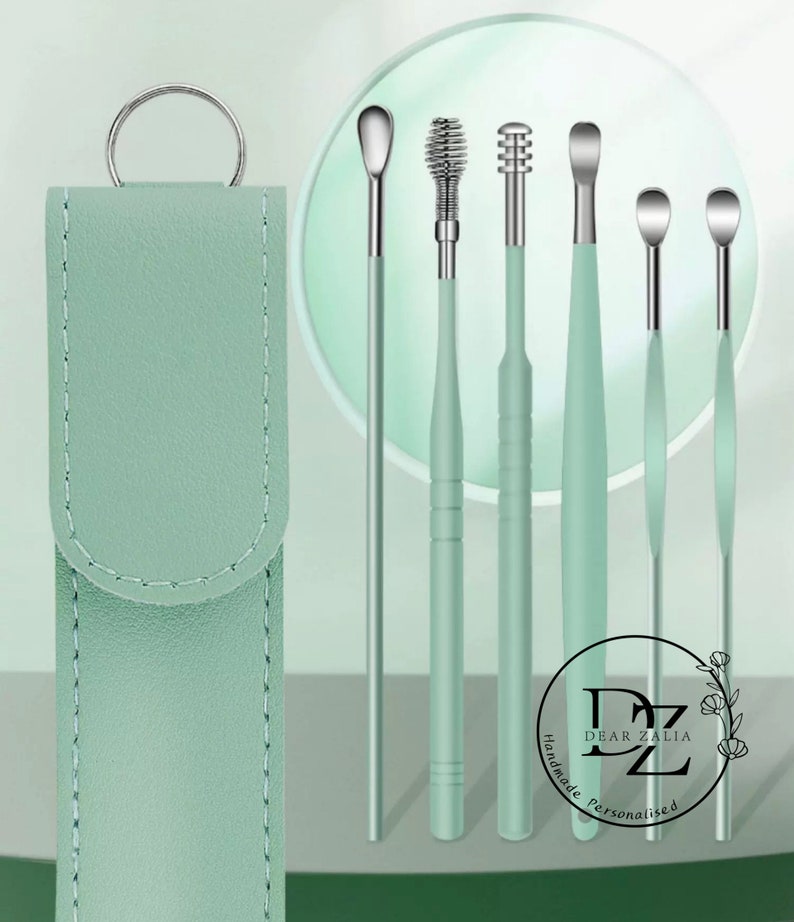 May include: Set of six green ear cleaning tools with a spiral, a pointed tip, and a rounded tip. The tools come in a green leather case with a silver ring.