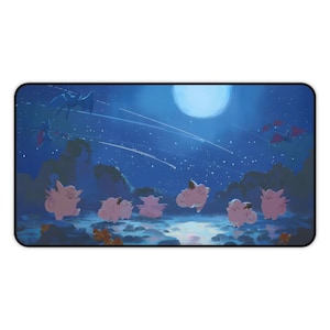 May include: A rectangular mousepad featuring a whimsical illustration. The design showcases several pink, cartoon-like creatures against a backdrop of a starry night sky, a large moon, and flying silhouettes. The color palette is dominated by blues and pinks.