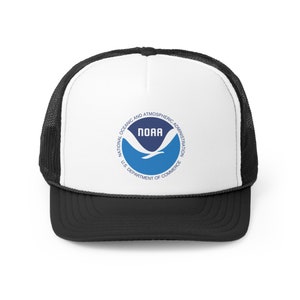May include: A black and white trucker hat with a blue and white NOAA logo. The logo reads "National Oceanic and Atmospheric Administration, U.S. Department of Commerce".