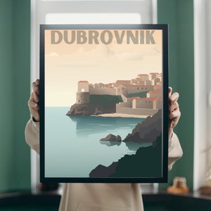 May include: A vintage travel poster with a black frame featuring a colorful illustration of the city of Dubrovnik, Croatia. The poster has the text "DUBROVNIK" in large, bold letters at the top.